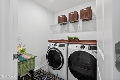 Discover your new light, bright, and delightfully modern on LPGA International Golf Course in Florida - for sale on GolfHomes.com, golf home, golf lot