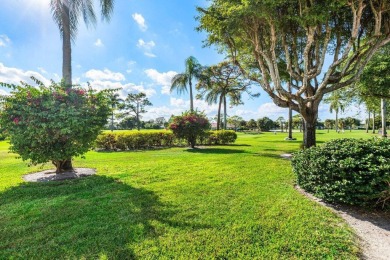Enjoy picturesque views of the lush golf course and serene on Quail Ridge Golf Course and Country Club in Florida - for sale on GolfHomes.com, golf home, golf lot
