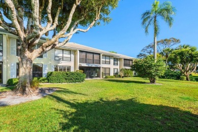 Enjoy picturesque views of the lush golf course and serene on Quail Ridge Golf Course and Country Club in Florida - for sale on GolfHomes.com, golf home, golf lot