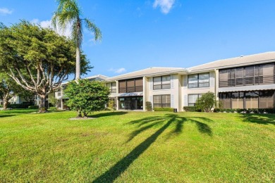 Enjoy picturesque views of the lush golf course and serene on Quail Ridge Golf Course and Country Club in Florida - for sale on GolfHomes.com, golf home, golf lot