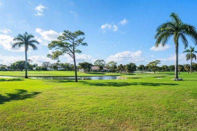 Enjoy picturesque views of the lush golf course and serene on Quail Ridge Golf Course and Country Club in Florida - for sale on GolfHomes.com, golf home, golf lot
