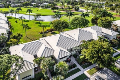 Enjoy picturesque views of the lush golf course and serene on Quail Ridge Golf Course and Country Club in Florida - for sale on GolfHomes.com, golf home, golf lot