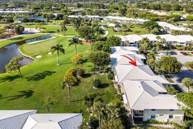 Enjoy picturesque views of the lush golf course and serene on Quail Ridge Golf Course and Country Club in Florida - for sale on GolfHomes.com, golf home, golf lot