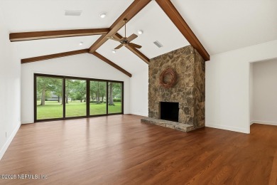 Timeless and inviting, this all-brick, one-level home is nestled on The Deerwood Country Club in Florida - for sale on GolfHomes.com, golf home, golf lot
