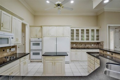 Presenting an exceptional custom home situated on two riverfront on Pecan Plantation Country Club in Texas - for sale on GolfHomes.com, golf home, golf lot