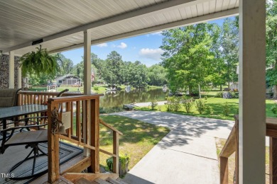 The Ultimate Waterfront Getaway awaits you at in a gated lake on River Golf and County Club at Lake Royale in North Carolina - for sale on GolfHomes.com, golf home, golf lot