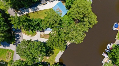 The Ultimate Waterfront Getaway awaits you at in a gated lake on River Golf and County Club at Lake Royale in North Carolina - for sale on GolfHomes.com, golf home, golf lot