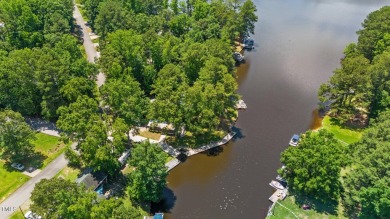 The Ultimate Waterfront Getaway awaits you at in a gated lake on River Golf and County Club at Lake Royale in North Carolina - for sale on GolfHomes.com, golf home, golf lot