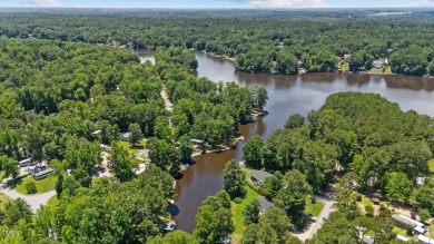 The Ultimate Waterfront Getaway awaits you at in a gated lake on River Golf and County Club at Lake Royale in North Carolina - for sale on GolfHomes.com, golf home, golf lot