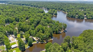 The Ultimate Waterfront Getaway awaits you at in a gated lake on River Golf and County Club at Lake Royale in North Carolina - for sale on GolfHomes.com, golf home, golf lot