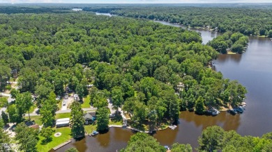The Ultimate Waterfront Getaway awaits you at in a gated lake on River Golf and County Club at Lake Royale in North Carolina - for sale on GolfHomes.com, golf home, golf lot