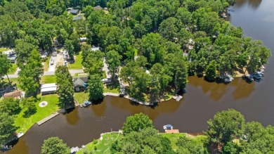 The Ultimate Waterfront Getaway awaits you at in a gated lake on River Golf and County Club at Lake Royale in North Carolina - for sale on GolfHomes.com, golf home, golf lot