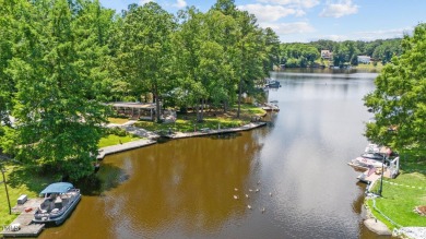 The Ultimate Waterfront Getaway awaits you at in a gated lake on River Golf and County Club at Lake Royale in North Carolina - for sale on GolfHomes.com, golf home, golf lot