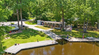The Ultimate Waterfront Getaway awaits you at in a gated lake on River Golf and County Club at Lake Royale in North Carolina - for sale on GolfHomes.com, golf home, golf lot
