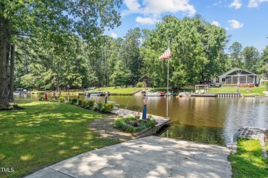 The Ultimate Waterfront Getaway awaits you at in a gated lake on River Golf and County Club at Lake Royale in North Carolina - for sale on GolfHomes.com, golf home, golf lot