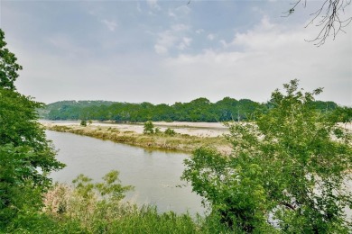 Presenting an exceptional custom home situated on two riverfront on Pecan Plantation Country Club in Texas - for sale on GolfHomes.com, golf home, golf lot
