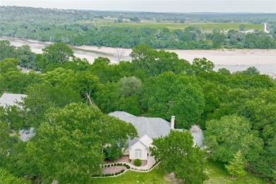 Presenting an exceptional custom home situated on two riverfront on Pecan Plantation Country Club in Texas - for sale on GolfHomes.com, golf home, golf lot