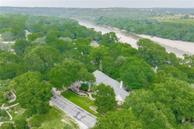 Presenting an exceptional custom home situated on two riverfront on Pecan Plantation Country Club in Texas - for sale on GolfHomes.com, golf home, golf lot