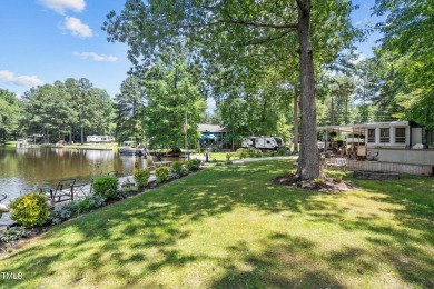 The Ultimate Waterfront Getaway awaits you at in a gated lake on River Golf and County Club at Lake Royale in North Carolina - for sale on GolfHomes.com, golf home, golf lot