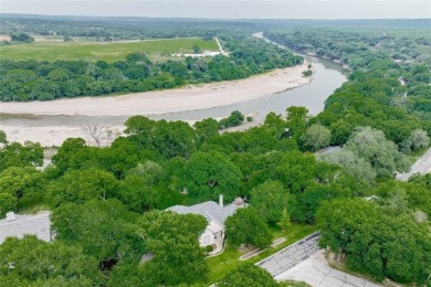 Presenting an exceptional custom home situated on two riverfront on Pecan Plantation Country Club in Texas - for sale on GolfHomes.com, golf home, golf lot
