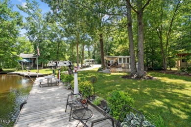 The Ultimate Waterfront Getaway awaits you at in a gated lake on River Golf and County Club at Lake Royale in North Carolina - for sale on GolfHomes.com, golf home, golf lot