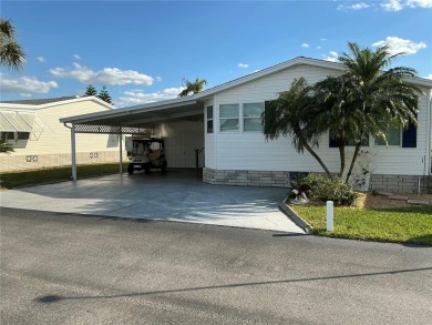 This charming two-bedroom, two-bath home offers an exceptional on Lily Lake Golf and RV Resort in Florida - for sale on GolfHomes.com, golf home, golf lot