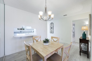 Looking for a lovely, updated condominium with a Structure on Hibiscus Golf Club in Florida - for sale on GolfHomes.com, golf home, golf lot