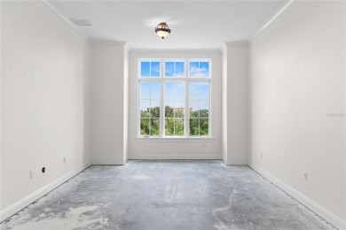 Discover luxury living in this exquisite two-story condominium on Winter Park Country Club in Florida - for sale on GolfHomes.com, golf home, golf lot