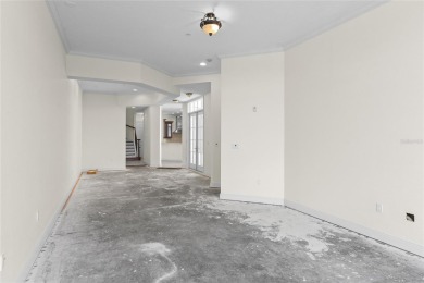 Discover luxury living in this exquisite two-story condominium on Winter Park Country Club in Florida - for sale on GolfHomes.com, golf home, golf lot