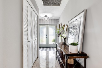 Your home search ends here in the highly desirable Palm Beach on Palm Beach National Golf and Country Club in Florida - for sale on GolfHomes.com, golf home, golf lot