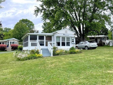 Enjoy summer in Vermont with a cottage at Apple Island Resort on on Apple Island Golf Course At Apple Island Resort in Vermont - for sale on GolfHomes.com, golf home, golf lot