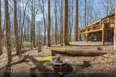 Experience the ease of relaxed mountain living in this inviting on Sapphire National Golf Club in North Carolina - for sale on GolfHomes.com, golf home, golf lot