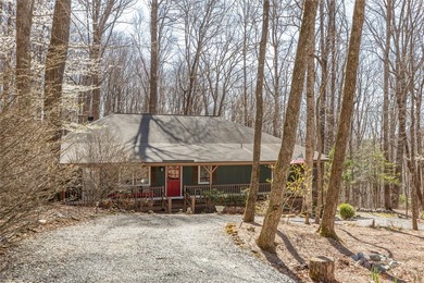 Experience the ease of relaxed mountain living in this inviting on Sapphire National Golf Club in North Carolina - for sale on GolfHomes.com, golf home, golf lot