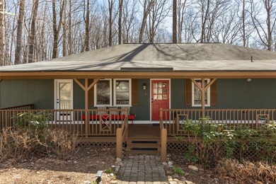 Experience the ease of relaxed mountain living in this inviting on Sapphire National Golf Club in North Carolina - for sale on GolfHomes.com, golf home, golf lot