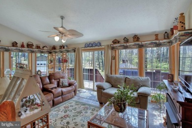 Tucked on a beautiful wooded 0.68 acre lot is this charming on Alpine Lake Resort in West Virginia - for sale on GolfHomes.com, golf home, golf lot
