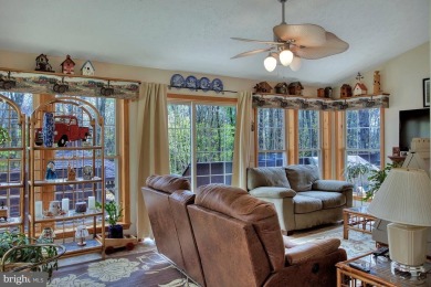 Tucked on a beautiful wooded 0.68 acre lot is this charming on Alpine Lake Resort in West Virginia - for sale on GolfHomes.com, golf home, golf lot