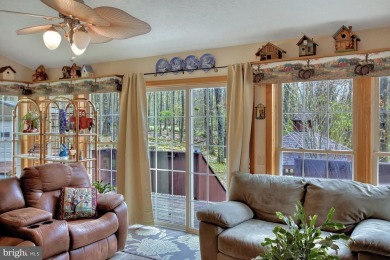 Tucked on a beautiful wooded 0.68 acre lot is this charming on Alpine Lake Resort in West Virginia - for sale on GolfHomes.com, golf home, golf lot