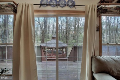 Tucked on a beautiful wooded 0.68 acre lot is this charming on Alpine Lake Resort in West Virginia - for sale on GolfHomes.com, golf home, golf lot