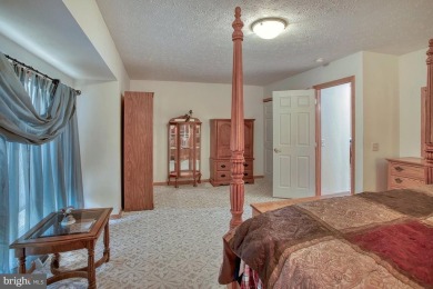 Tucked on a beautiful wooded 0.68 acre lot is this charming on Alpine Lake Resort in West Virginia - for sale on GolfHomes.com, golf home, golf lot