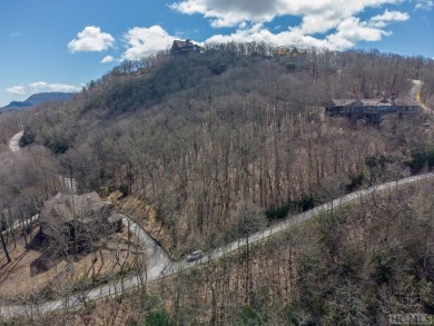 This lot offers a beautiful setting with expansive mountain on Old Edwards Club in North Carolina - for sale on GolfHomes.com, golf home, golf lot