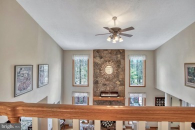 Tucked on a beautiful wooded 0.68 acre lot is this charming on Alpine Lake Resort in West Virginia - for sale on GolfHomes.com, golf home, golf lot