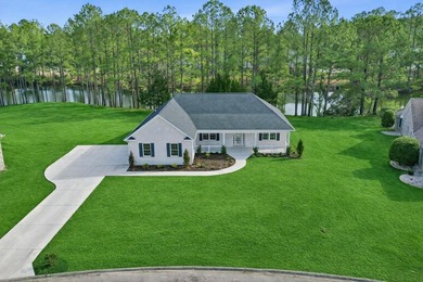 This brand-new, all-brick beauty delivers standout design on Long Bay Club in South Carolina - for sale on GolfHomes.com, golf home, golf lot