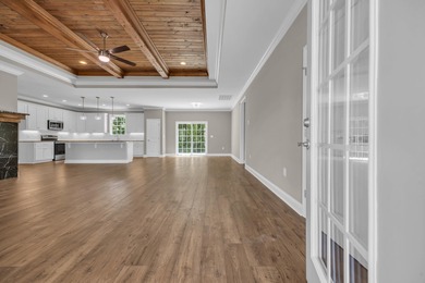 This brand-new, all-brick beauty delivers standout design on Long Bay Club in South Carolina - for sale on GolfHomes.com, golf home, golf lot