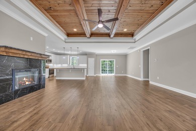 This brand-new, all-brick beauty delivers standout design on Long Bay Club in South Carolina - for sale on GolfHomes.com, golf home, golf lot