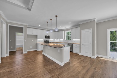 This brand-new, all-brick beauty delivers standout design on Long Bay Club in South Carolina - for sale on GolfHomes.com, golf home, golf lot