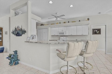 Gracefully set along the prestigious Calusa Lakes Golf Course on Calusa Lakes Golf Club in Florida - for sale on GolfHomes.com, golf home, golf lot