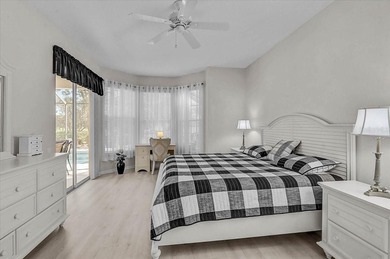 Gracefully set along the prestigious Calusa Lakes Golf Course on Calusa Lakes Golf Club in Florida - for sale on GolfHomes.com, golf home, golf lot