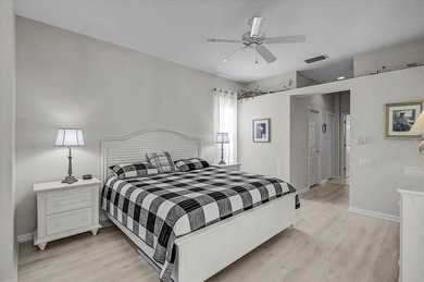 Gracefully set along the prestigious Calusa Lakes Golf Course on Calusa Lakes Golf Club in Florida - for sale on GolfHomes.com, golf home, golf lot