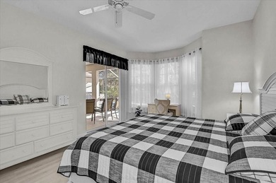 Gracefully set along the prestigious Calusa Lakes Golf Course on Calusa Lakes Golf Club in Florida - for sale on GolfHomes.com, golf home, golf lot