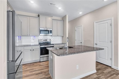 This beautifully maintained 3-bedroom, 2.5-bath townhome in the on Browns Mill Golf Course in Georgia - for sale on GolfHomes.com, golf home, golf lot